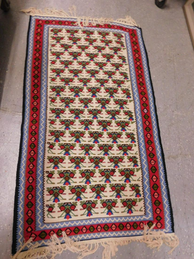 Turkish Tribal Kilim Carpet: Turkish Tribal Kilim Carpet, wool and cotton hand embroidered, cream ground with overall green, reds and blue medallion field and borders, fringed, 20th C, 3.5' x 5.10'. CONDITION: Excellent.