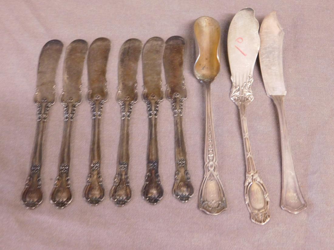 Sterling Butter Knives, etc.: Sterling Butter Knives, etc., includes: Rosette and Garland crested 6 3/4" narrow spoon; set of six Gorham Chantilly pattern, 6" and two others, 6 3/4" and 7", all monogrammed,7.57 ozts TW. CONDITION:
