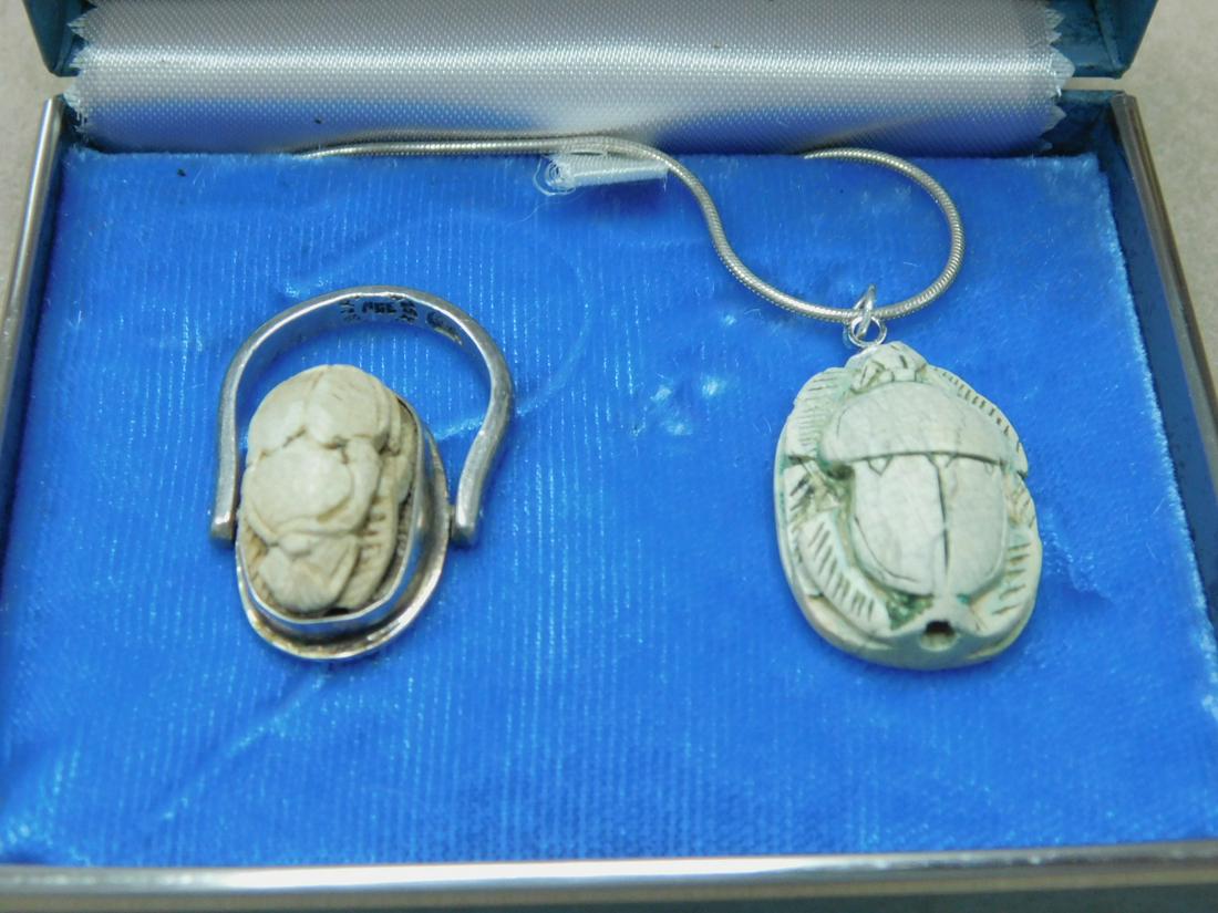 Sterling & Scarab Style Jewelry: Sterling and Scarab Style Jewelry, includes: a Mexican signed folding ring with a bezel set scarab 17 x 10mm, and a sterling 16" snake link chain with a 17 x 24mm scarab drop. CONDITION: Very good, us