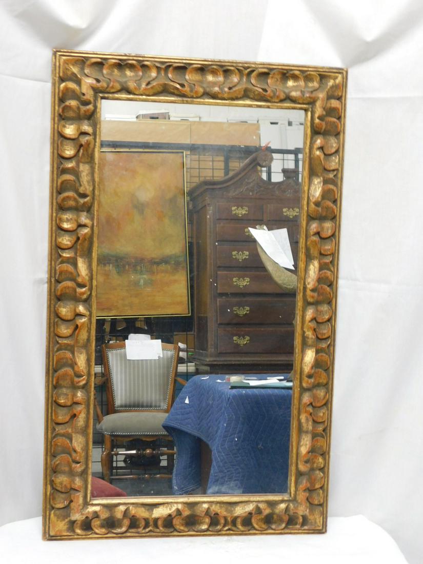Carved Wall Mirror: Carved Wall Mirror, carved and distressed gilt wood mirror, 30 1/2" x 17". CONDITION: Very good, used cond.