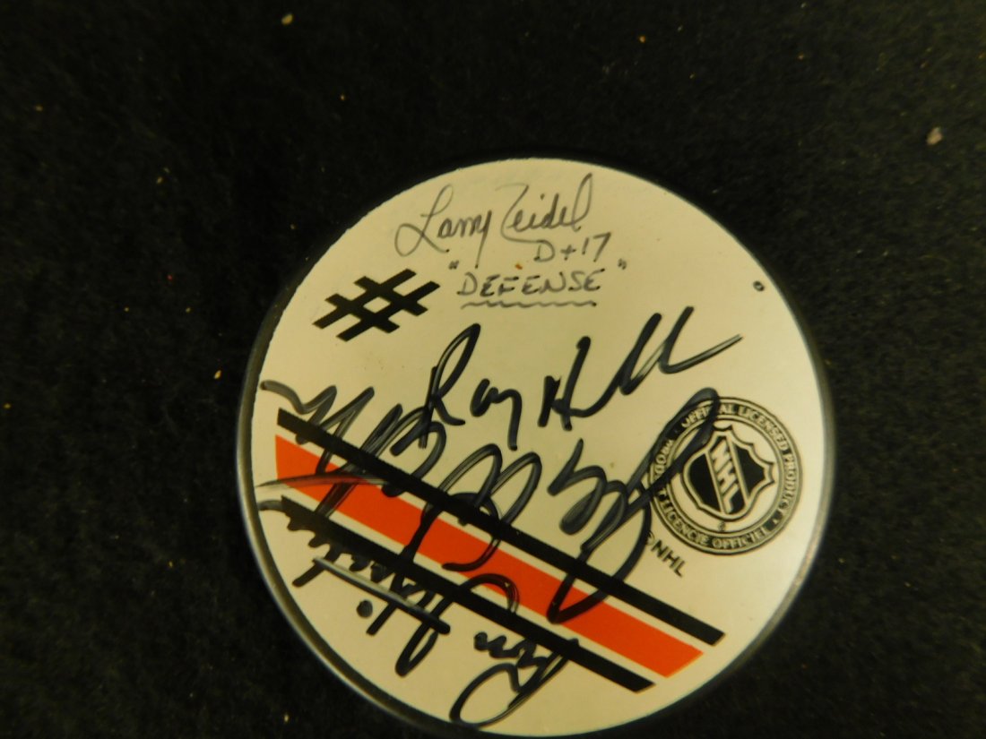 Phila. Flyers Autographed Hockey puck: Phila. Flyers Autographed Hockey puck, on original official NHL Flyers Autograph puck including: Larry Zeidel, Joe Watson, Ross Fitzpatrick and Ron Hextall? Note: We do not guarantee authenticity of a