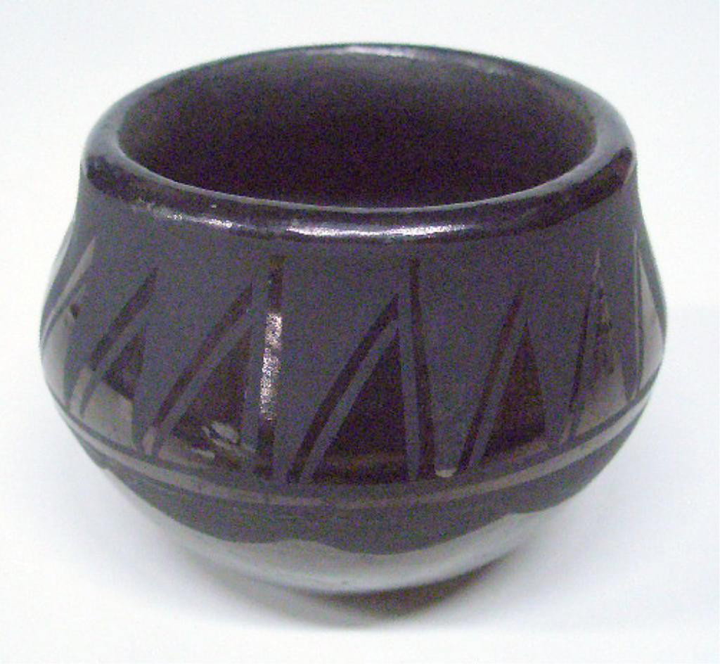 American Indian Pottery Bowl: American Indian black on black pottery bowl, base signed, "JM...SDP", 20th C., height 3 1/4" diameter. Condition: No issued identified.