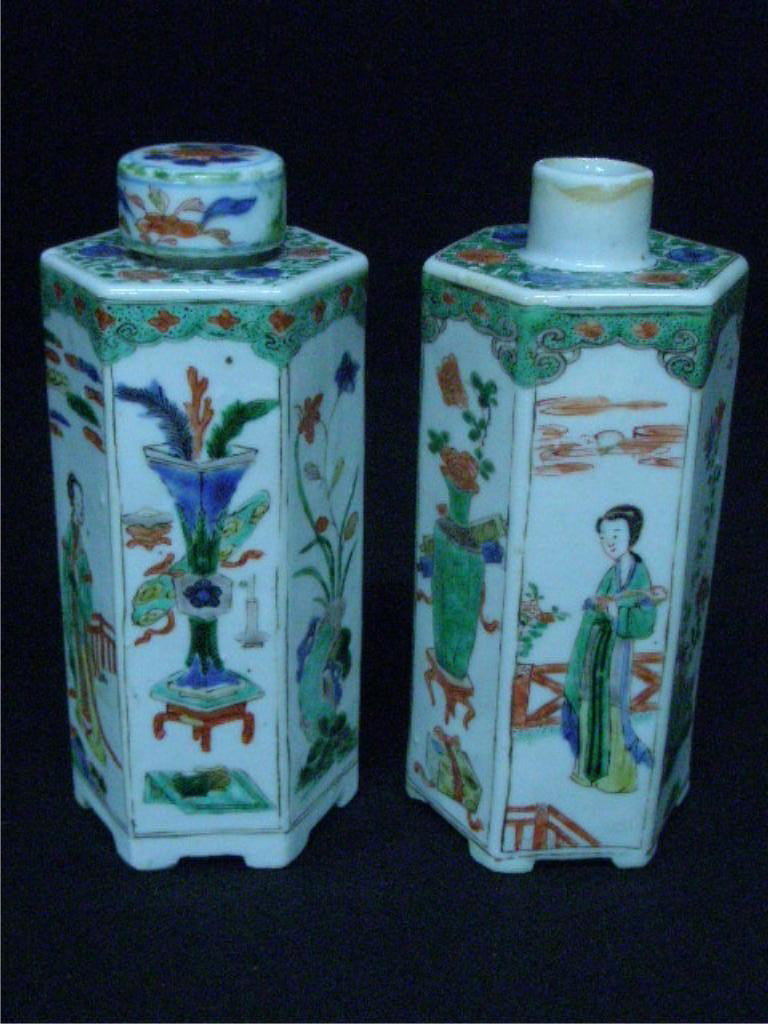 Pair Famille Verte Cologne Bottles: Pr. Famille Verte Cologne bottles, hexagonal, with painted panels of women, urns & flowers, 19th c., hgt 6 3/4". Condition: One lid cap missing and one lid cap cracked & chipped, foot missing on base 