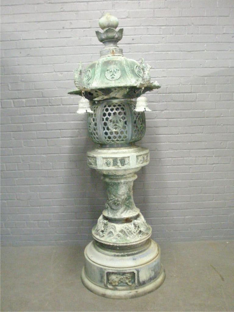 Japanese Bronze Garden Lantern: Japanese Bronze Garden Lantern, in 5 sections, Pagoda form crest with koi fish & bells & flying birds, deep relief cast dragons, turtles & waves on column, foo dog panels on base, late 19th - 20th c.
