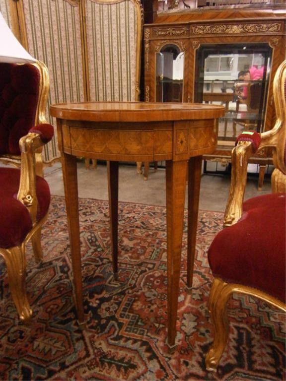 Antique Louis XVI Style End Table: Antique Louis XVI style mixed wood, inlaid, and parquetry end table with single drawer; brass spade feet, French, 19th c. 28 1/4"=H; 18 3/4"=diameter of top. Condition: One leg with small abrasion at