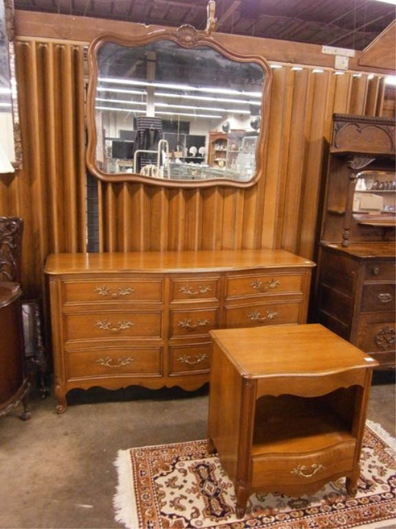Kindel Grand Rapids 3Pc Bedroom Set: Kindel Grand Rapids 3pc bedroom set, French Provincial style, Cherry wood, includes: triple dresser, mirror, stand, circa 1960. Condition: No issues identified.