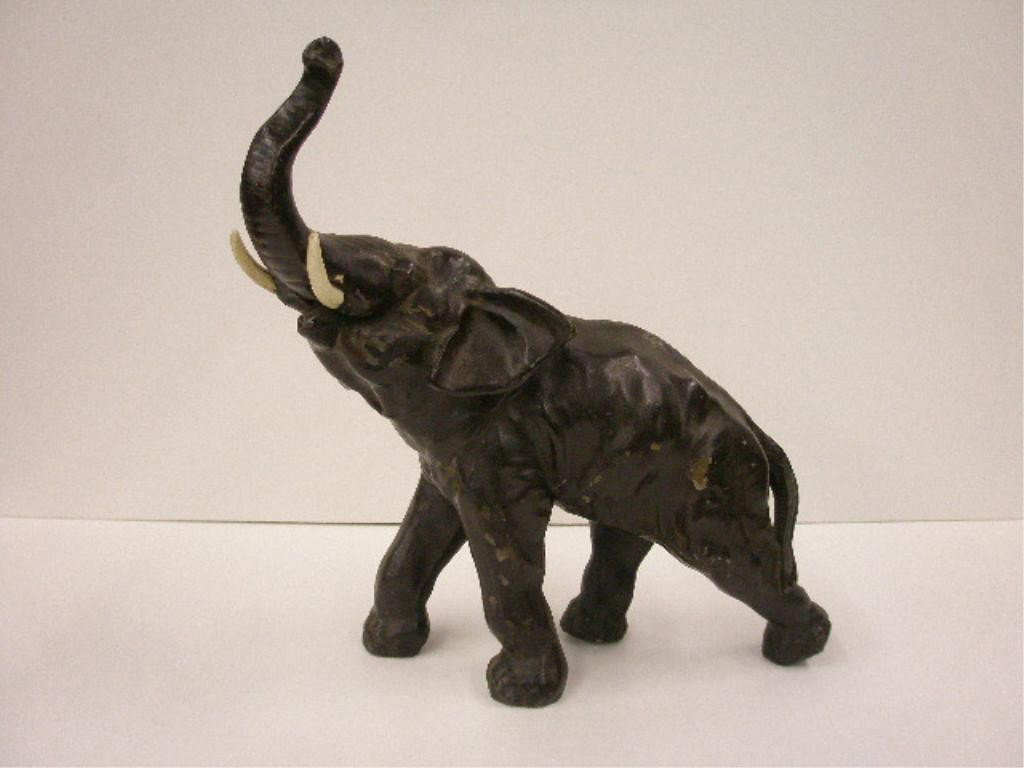 Vintage Cast Metal Elephant Doorstop: Vintage painted cast metal 16" x 13" Elephant doorstop. CONDITION: Areas with wear & or loss.
