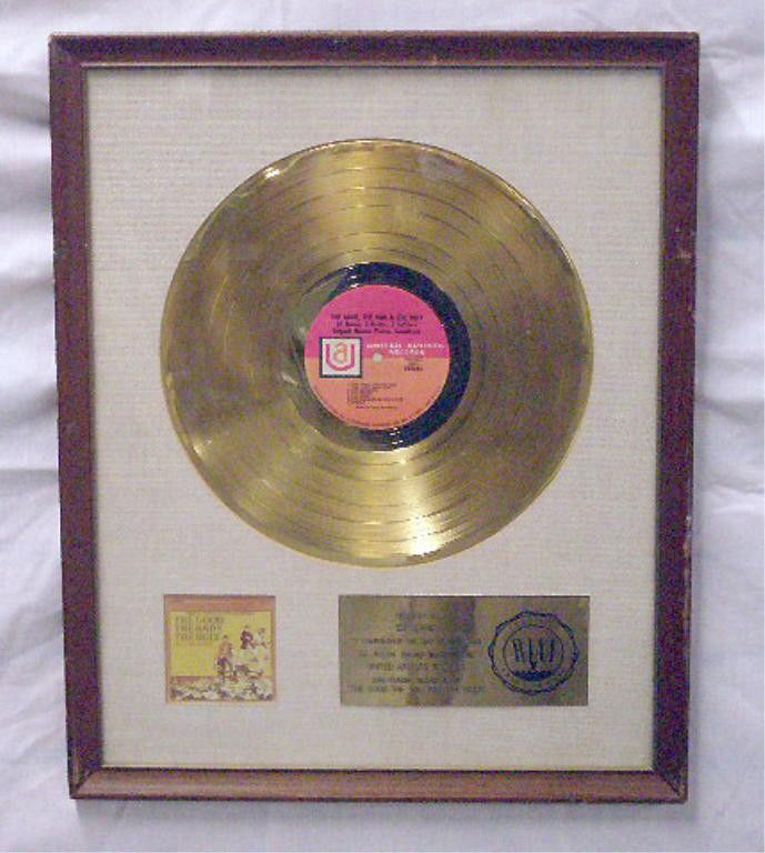 The Good, Bad & The Ugly Gold LP Record Display: The Good, The Bad & The Ugly, original motion picture soundtrack, gold LP record display, set into a 17 1/2" x 21 1/2" frame, RIAA certified plaque, presented to Ed Levine. Provenance: From the daught