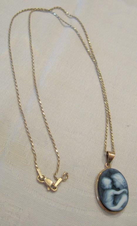 14k YG Mother And Child Cameo Drop & Chain: 14k yg mother and child cameo drop and chain, hardstone double & cameo with onyx 20" length fine rope chain. CONDITION: Very good, normal wear.