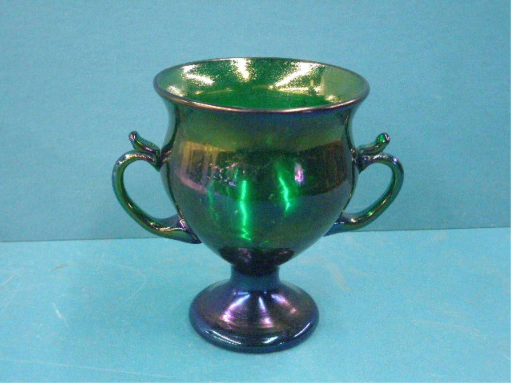 Loetz Art Glass Vase: Loetz art glass iridescent green 5 1/2" double handled vase. CONDITION: Very good with minor wear and scratches on base.