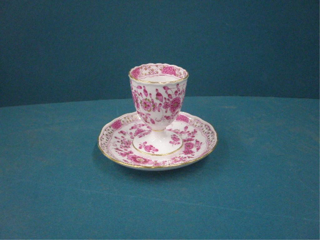 Meissen Porcelain Egg Cup on Stand: Meissen porcelain 4" x 3 1/2 egg cup on stand with hand painted floral design. CONDITION: Very good with no damage.