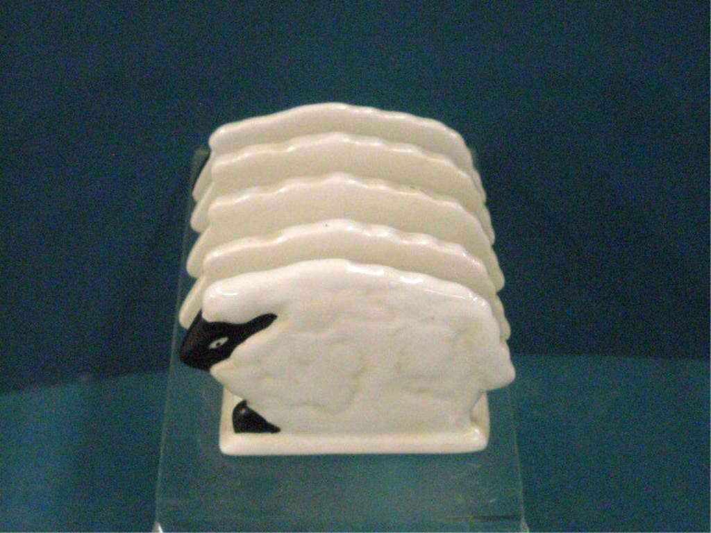 Carlton Ware Pottery Sheep Toast Rack: Carlton Ware English pottery 3 1/2" x 3" x 4 1/2" four slice sheep form toast rack. CONDITION: Very good with no damage.