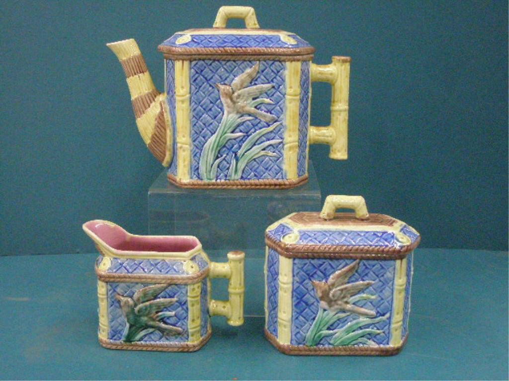 Griffin, Smith and Hill Majolica Tea Set: c. 1879-1889 Griffin, Smith and Hill Etruscan Majolica Bird and Iris pattern 3 piece tea set, 8 1/2" x 6" tea pot, 5" x 4" creamer and 4 3/4" x 5" covered sugar bowl. CONDITION: Teapot has small chips