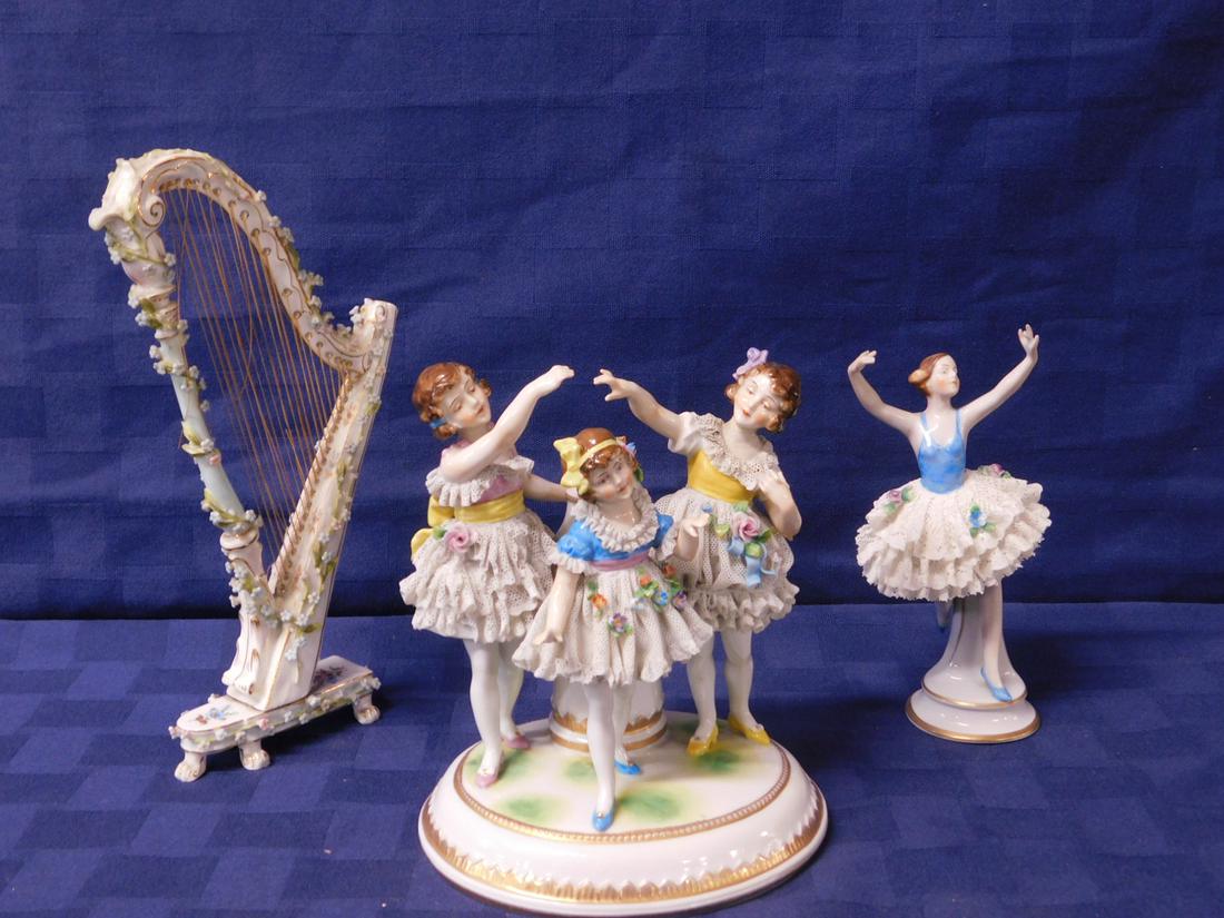 German Lace Work Figures: German Lace Work Figures, includes: three figures on oval base 5" x 6 1/2" x 4 1/2", and a ballerina 6 1/4"h, both with crown marks, plus an unmarked delicate porcelain harp with applied flowers, 9"h,