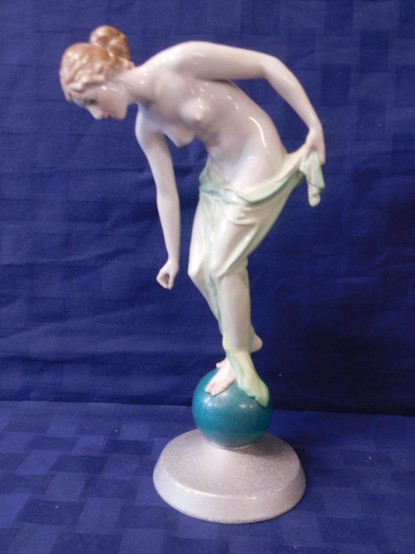Rosenthal Porcelain Nude: Rosenthal Porcelain Nude, Germany, painted semi clad female nude, standing upon a green sphere and silvered base, mid 20th C, 12 1/4"h. [27] CONDITION: Very fine.