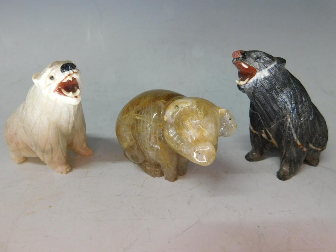 3 Carved Agate Animals: 3 Carved Agate Animals, includes: rutilated quartz pig (3" x 2 1/8"); white agate carved polar bear, ( 3 1/2"h) and a bear in white staked, charcoal agate (2 7/8"h, 3 1/4"l), late 20th C. [40 E] CONDI