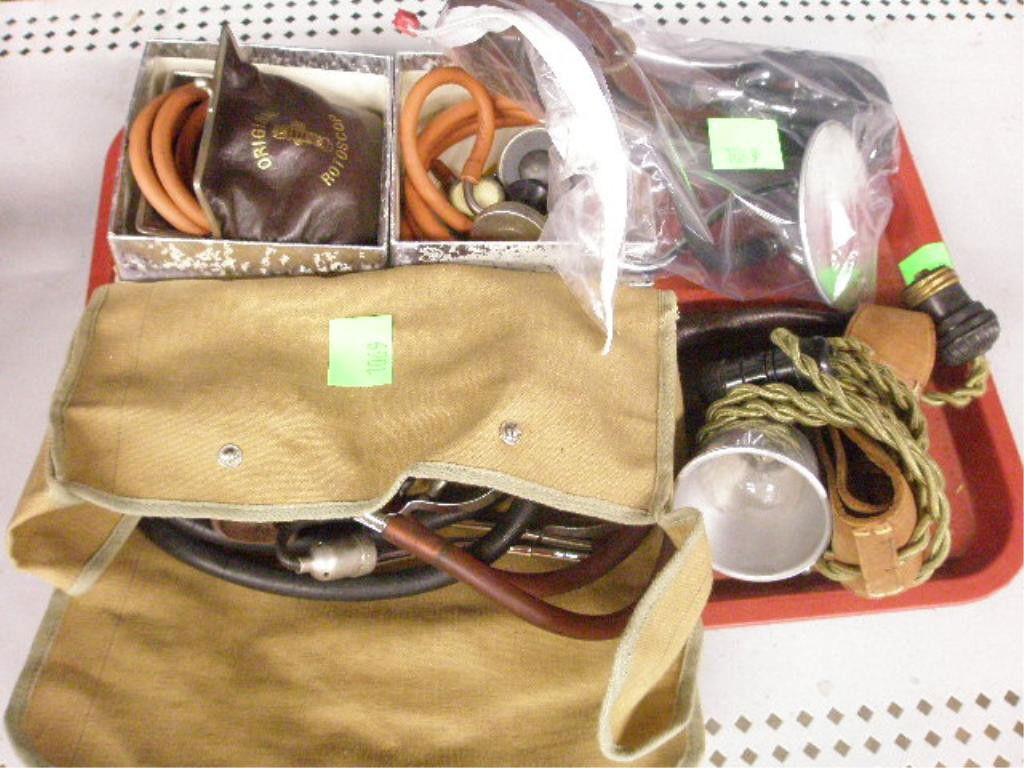 Lot of 4 Stethoscopes, Head Mirror, Head Lamp: Lot of (4) stethoscopes, head mirror, head lamp. CONDITION: Fair, rubber hoses on stethoscopes dried & cracked.