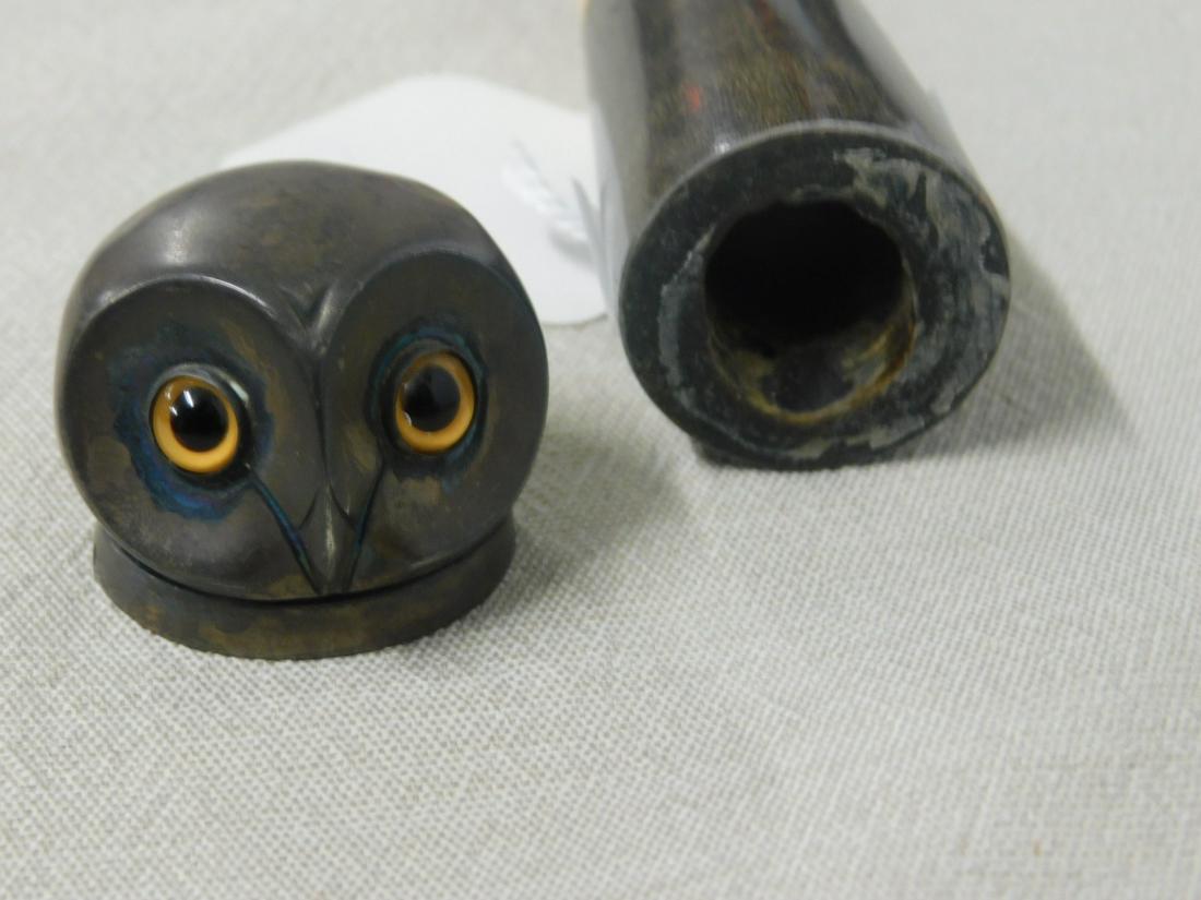 Owl Head Cane: Owl head cane. Handle: English sterling silver owls head with large glass eyes hinged and open to a storage area. (53). Shaft: Multi color stacked and tapering horn rings. Ferrule: Brass. Length: 34 1