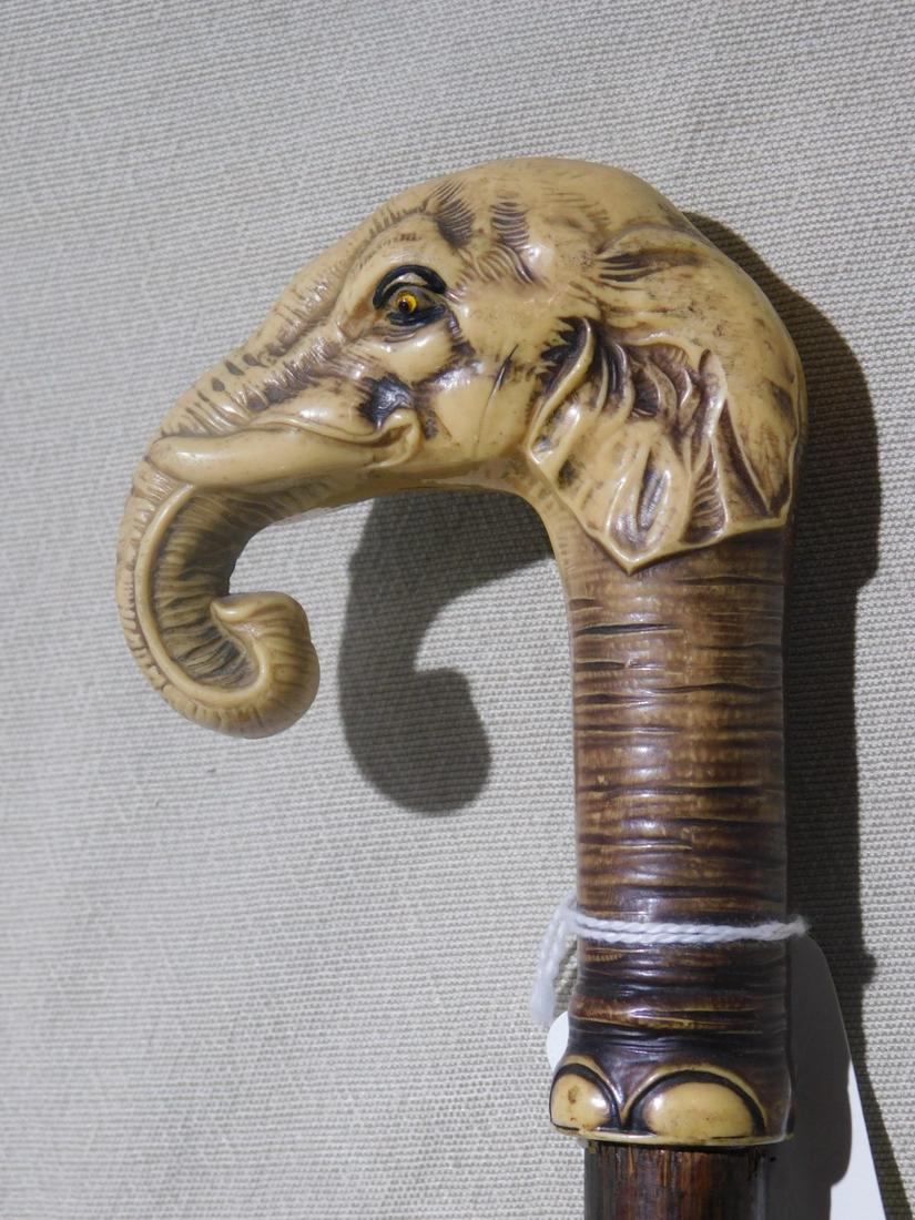 Elephant Handle Cane: Elephant Handle Cane. Handle: Celluloid molded elephant head with glass eyes. Shaft: bamboo. Ferrule: Steel with hard rubber tip. Length: 35". Vintage: Early 20th C. [1] CONDITION: Used, very good, so