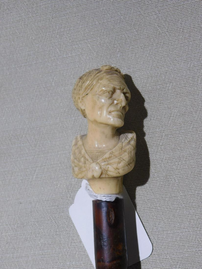 Old Lady Bust Cane: Old Lady Bust Cane. Handle: Sculptured & carved bust of old lady with head scarf and shoulder wrap. Collar: Missing. Shaft: Bamboo.. Vintage: Late 19th C. [21] CONDITION: Very good, missing collar. VE
