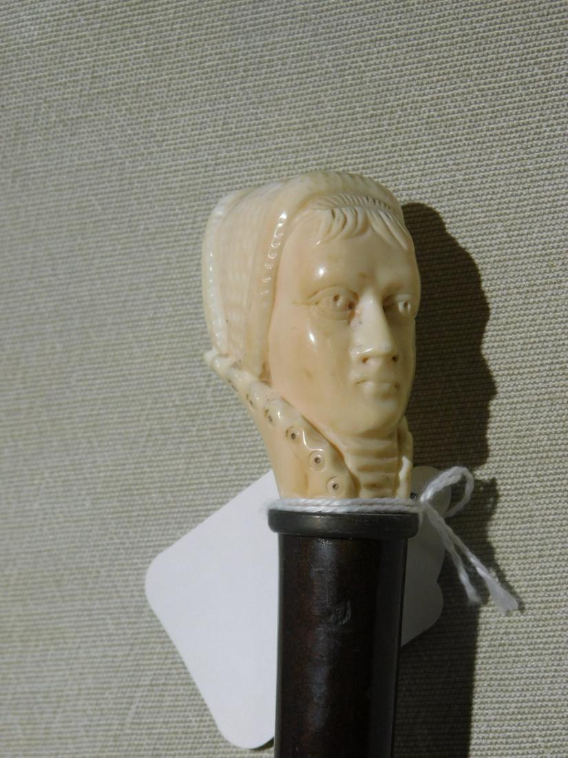Carved Lady's Head Cane: Lady Head Cane. Handle: Carved Elizabethan style lady with head cover and high collar. Collar: Brass. Shaft: Hardwood. Ferrule: Metal. Vintage: 19th / 20th C. [40] CONDITION: Tarnished metal. VERY IMP