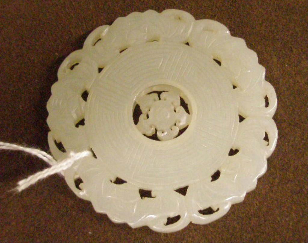 White Jade Disc: White jade disc, reticulated carved with rotating rosette center, 19th C., 2 3/8" diam. [1]