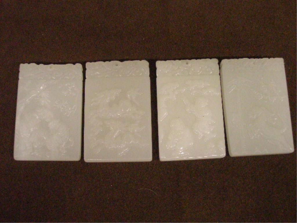 4 Assorted Chinese White Jade Pendants: Four assorted Chinese carved white jade pendants, deer 2 3/8" , horse 2 1/4", tigers 2 1/4" & two gentlemen 2 3/8", 20th C.