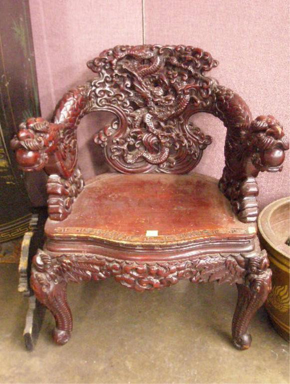 Chinese Dragon Carved Arm Chair: Chinese dragon carved arm chair, rosewood stained wood, plank seat, early 20th C. 34" hgt.