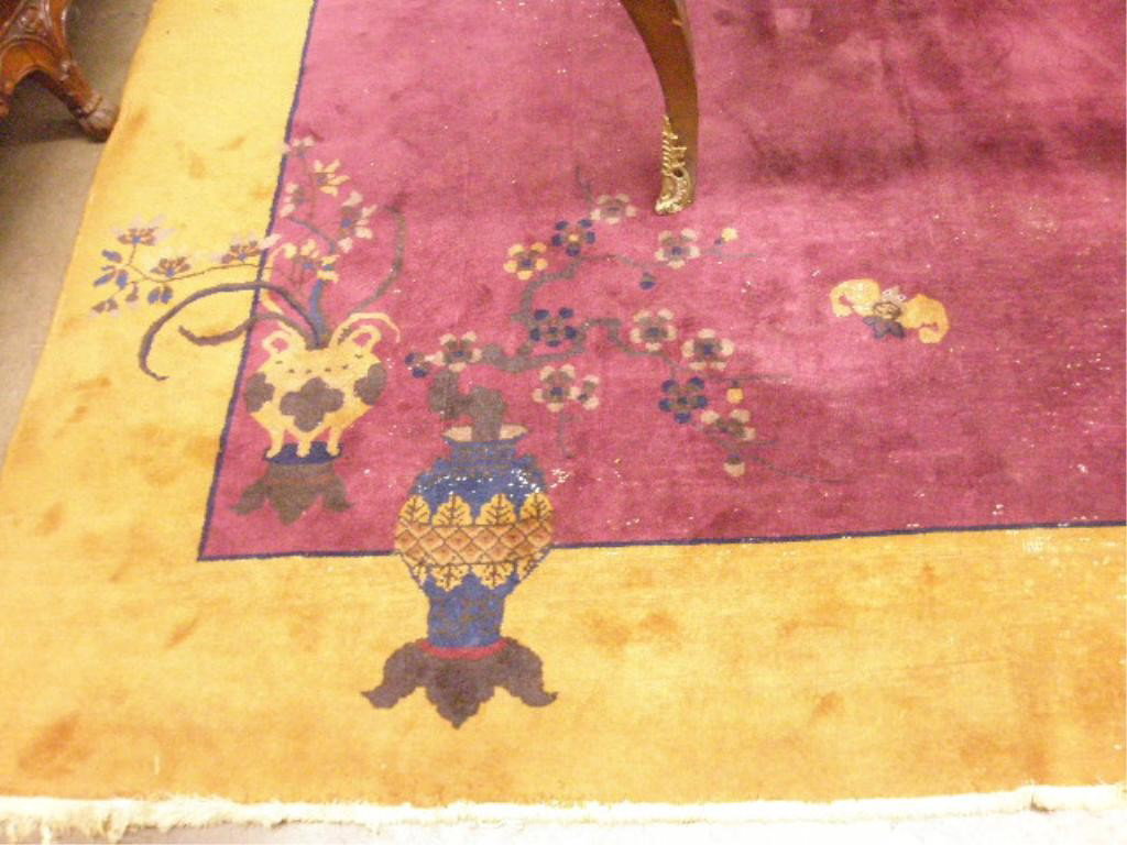 Art Deco Chinese Carpet: Art Deco Chinese carpet in rust & maroon with dogwoods, bats & floral urns at opposite corners, early 20th C., 9'6" x 7'9".