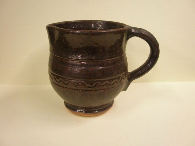 Stahl Pottery Pitcher: Stahl pottery brown glazed redware 4 1/2" x 5 1/2" pitcher, incised mark on base made by T.S. Stahl Aug / 14/47.