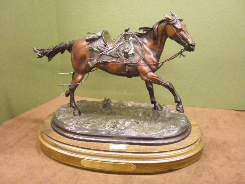Bob Parks Bronze Horse Sculpture: Bob Parks signed contemporary bronze 10 1/2" x 14" "Empty Saddle" horse sculpture, mounted on a swivel wood base, 12 1/2" x 15" overall size.
