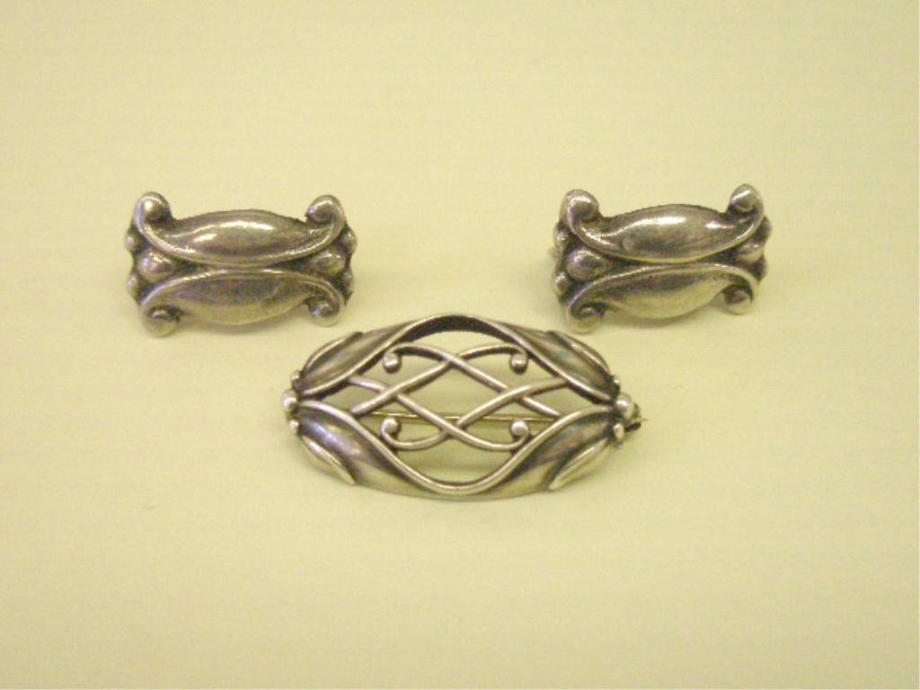 Georg Jensen Sterling Pin other earrings: Georg Jensen sterling silver pin, with pair sterling clip earrings (no maker's mark. Pin #288A, 1" x 1/2", leaf & pierced design. Earrings 3/4" x 7/16".