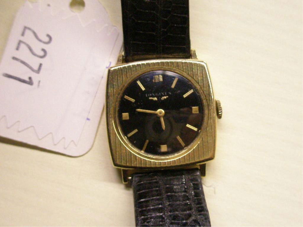 14k YG Longines Man's Watch: 14k yg Longines man's watch, vintage square case with black dial & gold bar hour indicators & hands, 17 jewels, #12925733, back weighs 4 DWT & numbered $6009, #634882, black 9" lizard band. [4]