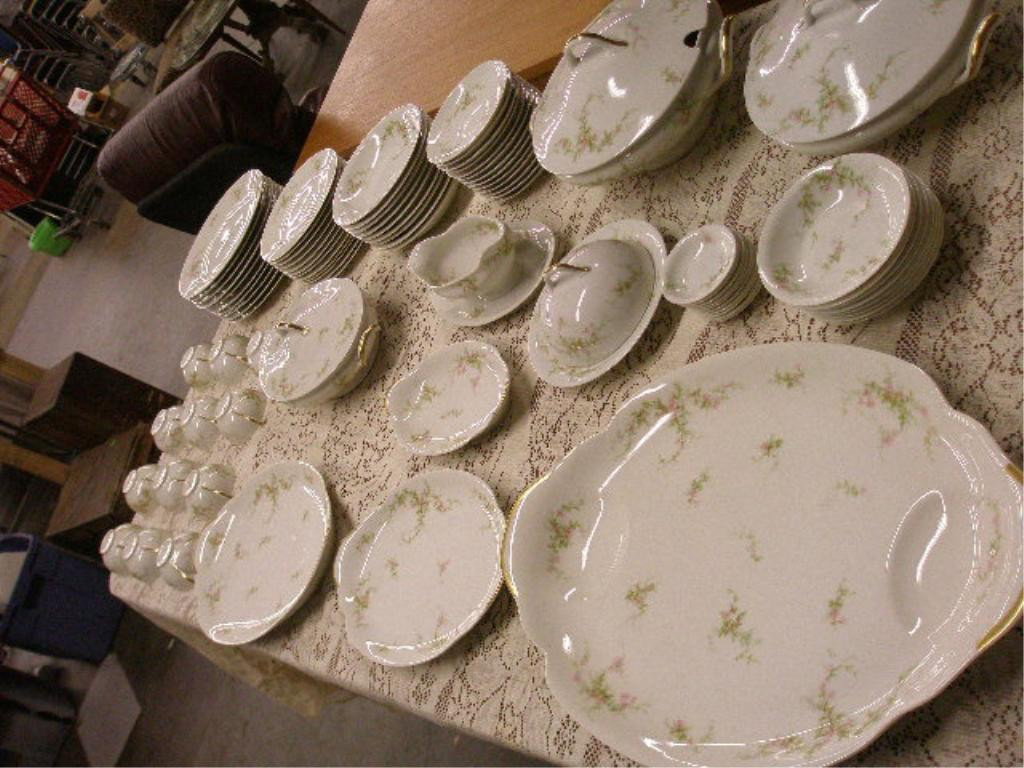 Theodore Haviland Limoges China Set: Antique Theodore Haviland Limoges 84 piece china set, hand painted floral design, (13) 5 1/2" saucers, (12) cups, (12) 7 1/2" salad plates, (10) 9 7/8" dinner plates, (9) 71/2" soup bowls, (10) 3" but