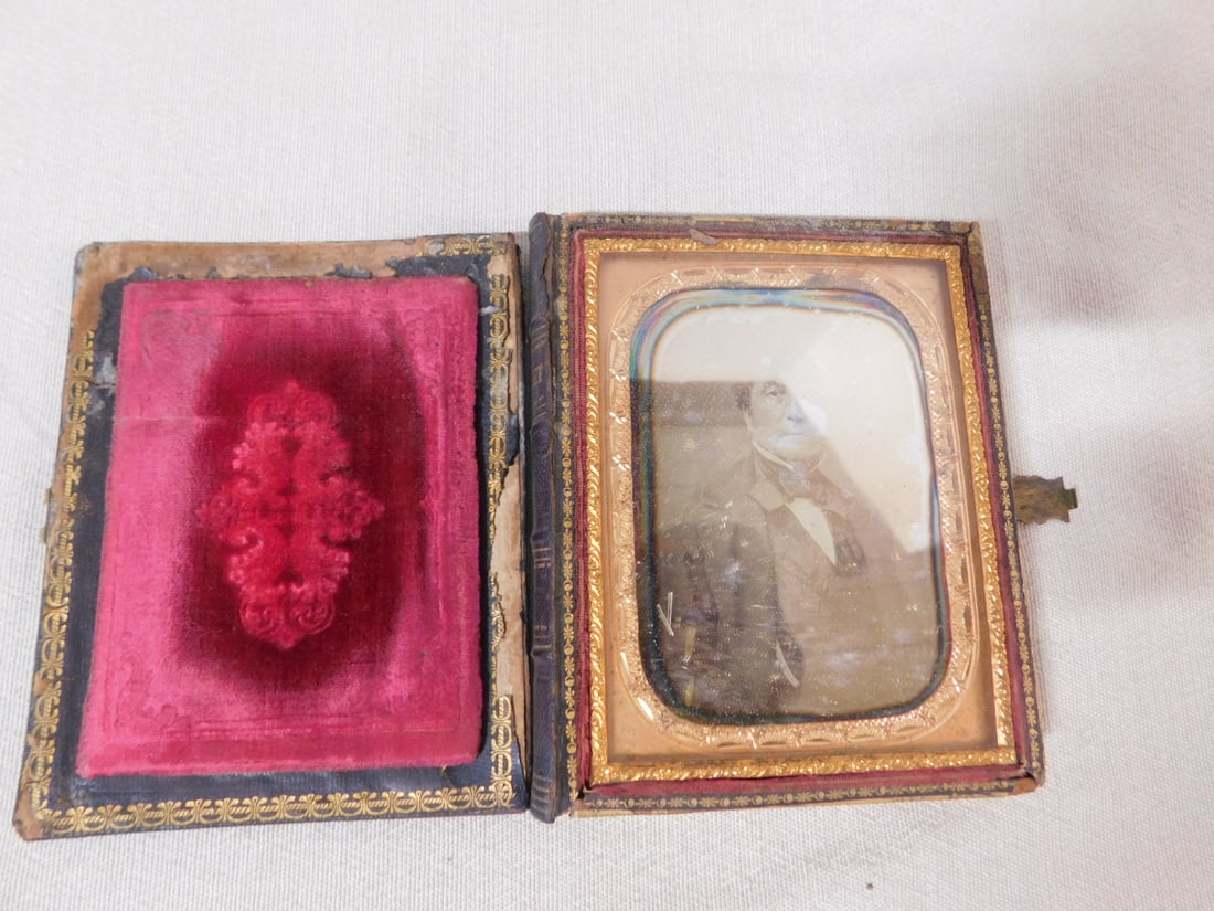 Quarter Plate Daguerreotype: Quarter Plate Daguerreotype, Victorian black lacquered book form with mother of pearl inlays and gilt painted scrolls and flowers, leather binder titled "Casket", interior with a dore brass mat and 1/