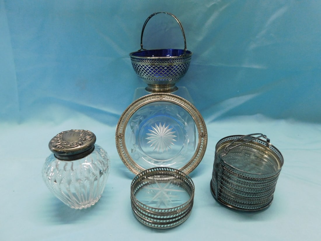 Sterling & Glass Group: Sterling and Glass Group, includes: Watson No. B83 reticulated basket with cobalt glass liner - 4 3/4"d, a cut glass jar with repousse sterling lid 3 1/2"h, sterling coaster stand with eight matching