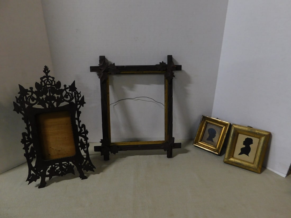 Silhouettes & Frames: Silhouettes and Frames, includes: two gilt framed, early 19th C, female portrait silhouettes, approx. 4 1/2" x 5"; a Tramp Art type, walnut, free standing frame with open work foliate and scroll carvi