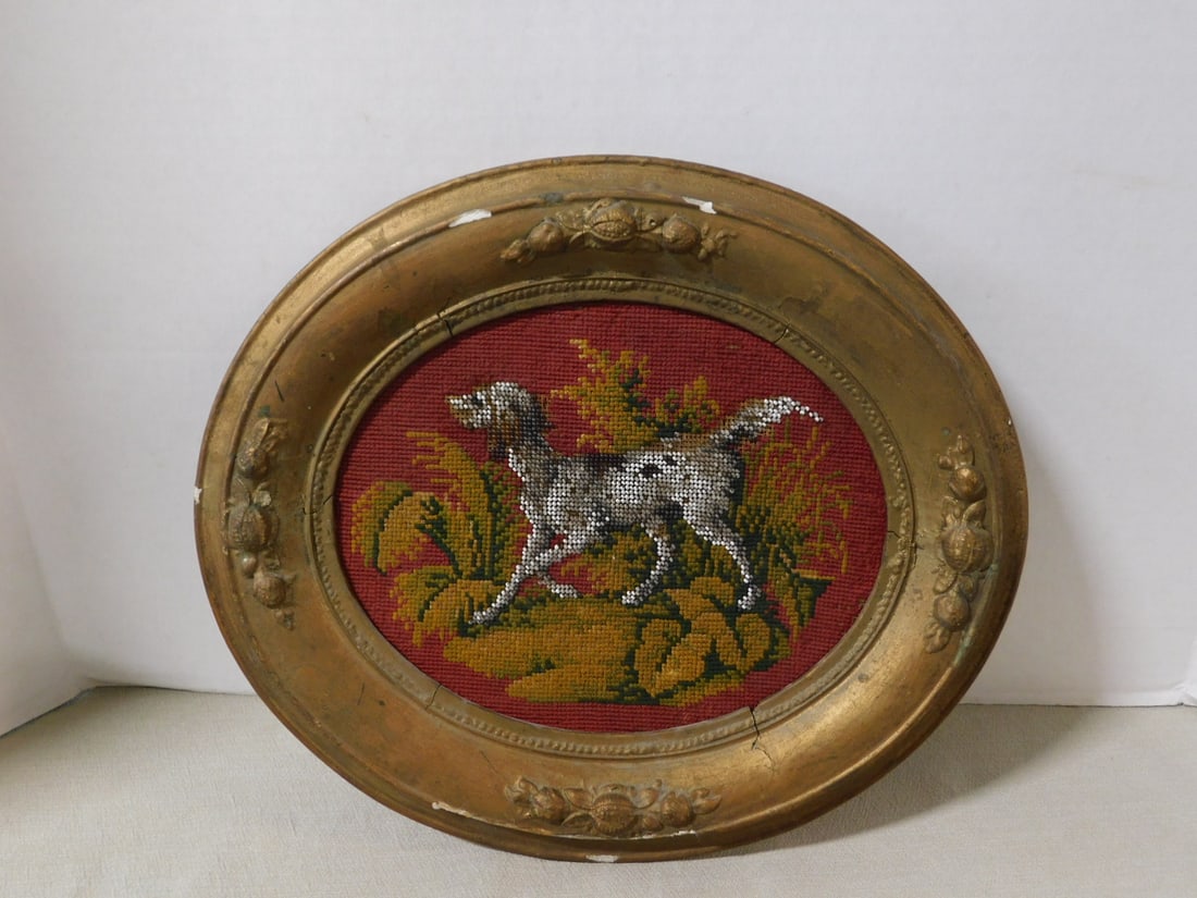 Victorian Framed Dog Needlepoint: Victorian Framed Dog Needlepoint, needlepoint and bead work settler dog ingilt oval frame, sight 8" x 8 1/2", frame 12 1/2" x 14 1/2', late 19th C. CONDITION: Some bed work losses on dog, losses to fr