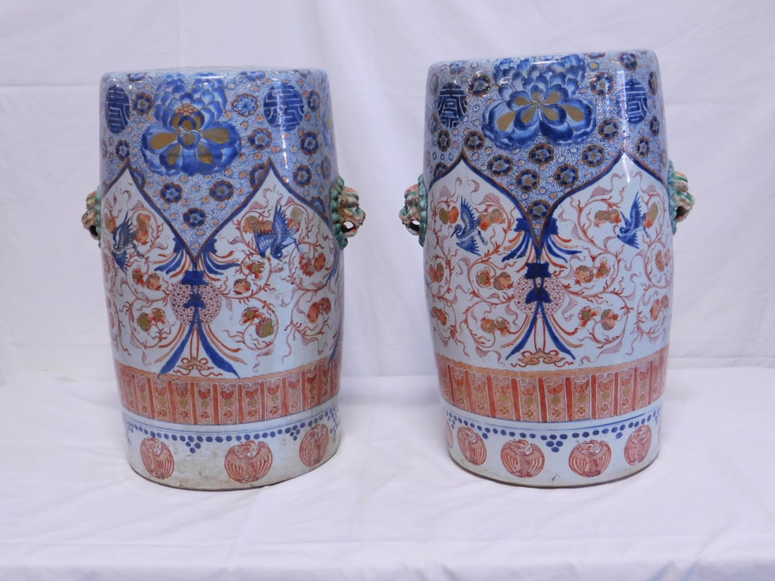 Pair Chinese Export Garden Seats: Pair Chinese Export Garden Seats, Imari Palette porcelain barrel form, features blue, cream and iron red arches, scrolls, cranes, peonies and pomegranates; lion mask handles, circa 18th / 19th C, 19"h