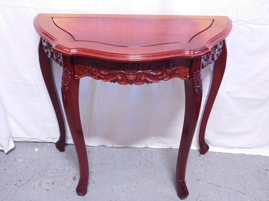 Chinese Console Table: Chinese Console Table, rosewood finish, fan, acanthus and scroll carved, serpentine front with drawer, cabriole leg, late 20th c, 32 1/2" x 15" x 31 1/2". CONDITION: Small area of finish wear.