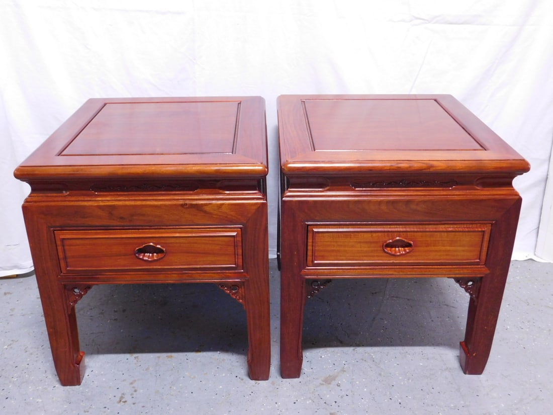 Pr Chinese End Tables: Pair Chinese End Tables, Rosewood finish, framed tops, relief carved ogee frieze, single drawer, corner brackets, late 20th C, 20" x 22" x 22". CONDITION: A few light scratches.
