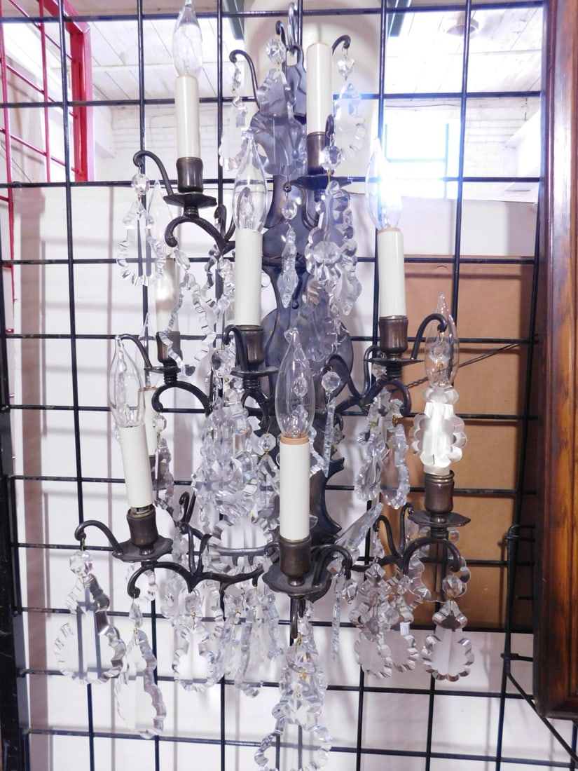 Pr Baroque Style Wall Sconces: Pair Baroque Style Wall Sconces, patinated bronze, nine lights with large cut and shaped glass prisms, 20th C, 25" x 15 1/2" x 10". CONDITION: Very good. No issues identified.