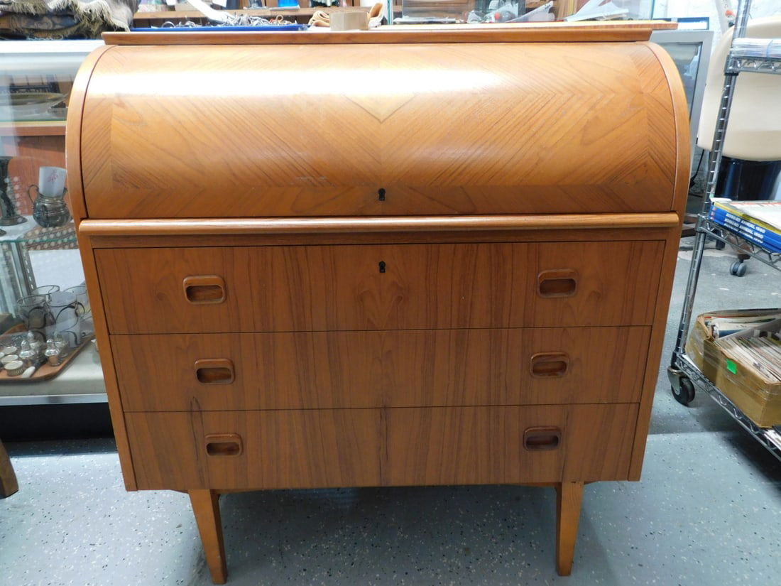 MCM Egon Ostergaard Style Roll Top Desk: MCM Roll Top Desk, Egon Ostergaard type Scandinavian, teakwood, parquet veneered cylinder top, fitted interior, three base drawers, pull out writing surface, 35 1/2" x 18 3/4" x 38 1/2". CONDITION: A