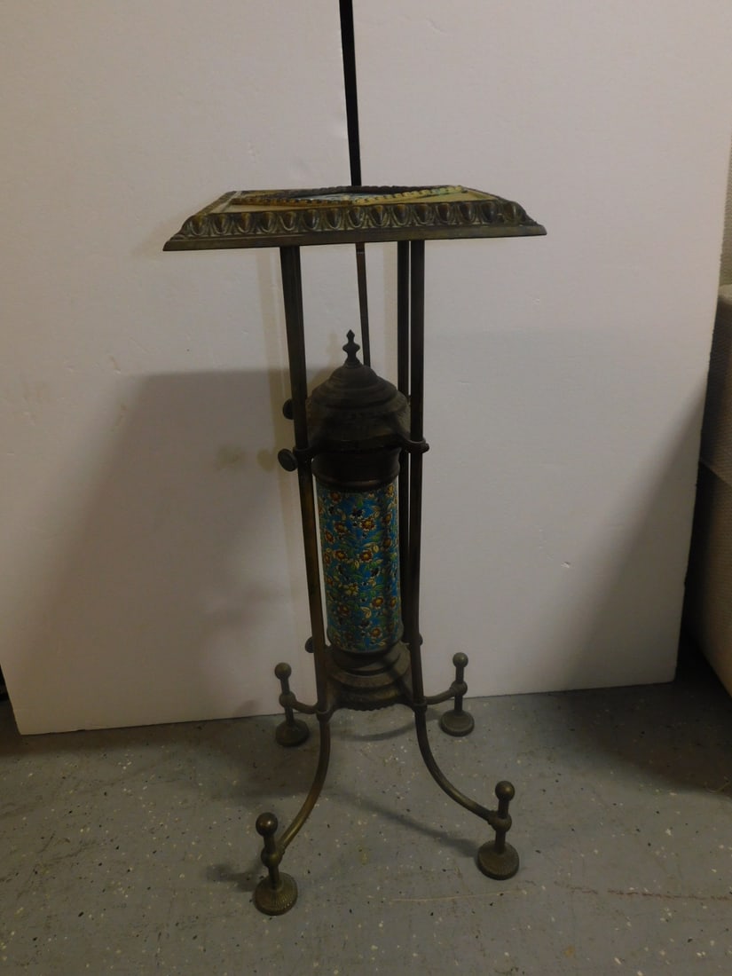 Aesthetic Movement Stand: Aesthetic Movement Stand, Bradley & Hubbard, brass with Longwy pottery tile top and cylindrical column, circa 1885, 31 1/2" x 11 3/4' x 11 3/4". CONDITION: Tarnished, three leg support round nuts miss