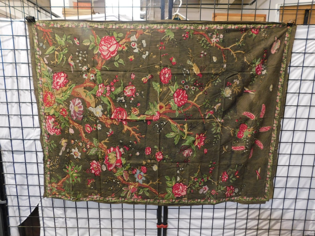 Batik - Floral Garden: Batik - Floral Garden, avocado ground with multi colored garden landscape of flowers, trees, birds and squirrels, 19th / 20th C, approx. 50" x 68". CONDITION: Some edge wear and light staining.