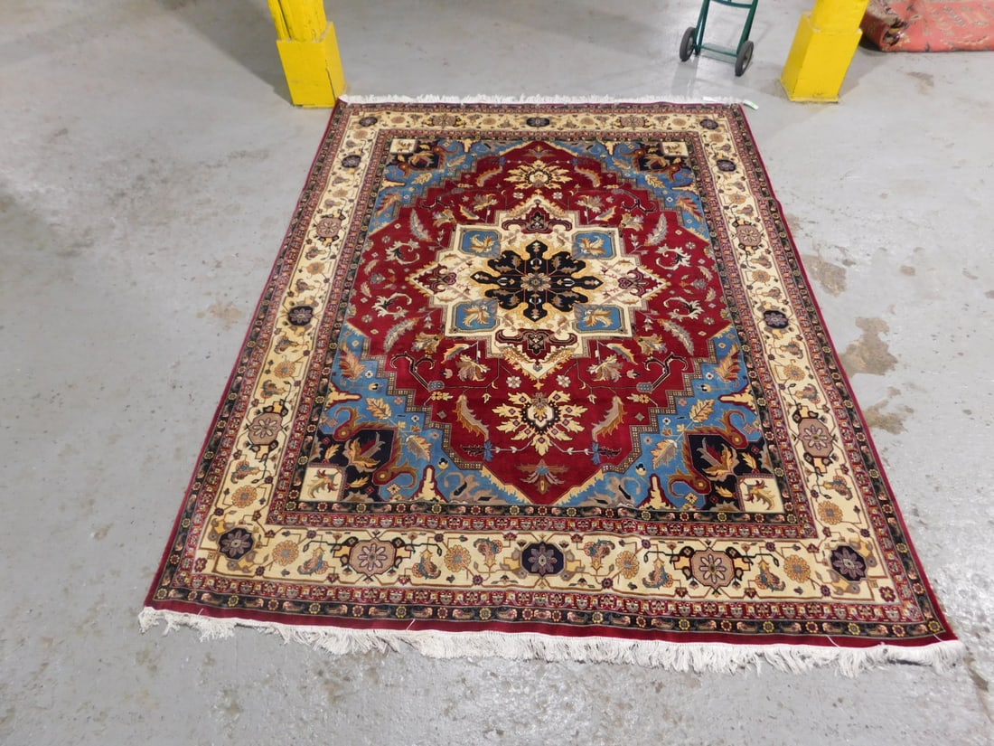 Heriz Room Carpet: Heriz Room Carpet, multi colored central medallion, spandrels with cream colored border and red ground, 8.3' x 10.7'. CONDITION: Very fine.