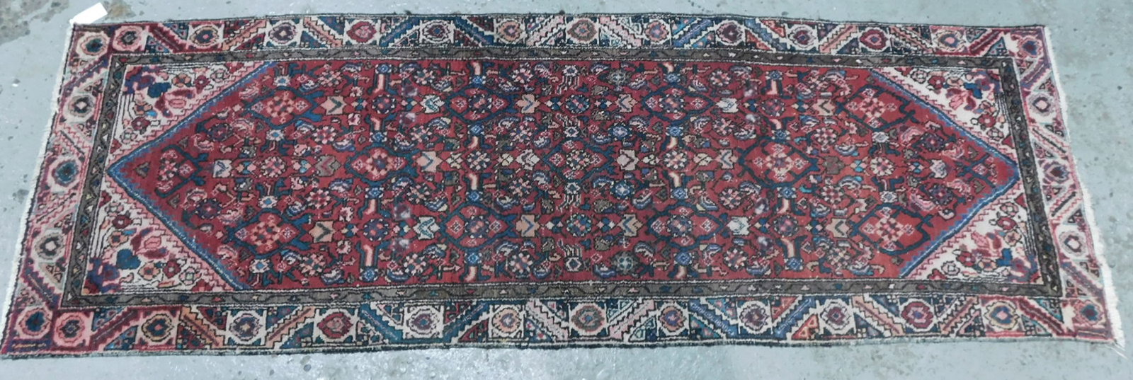 Hamadan Runner: Hamadan Runner, maroon ground, blues, green and beige floral field and geometric border; 8' 10" x 3', early 20th C. CONDITION: Used, modest expected wear.