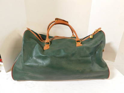 Ricardo Beverly Hills Green Leather Duffle Bag: Ricardo Beverly Hills Green Leather Duffle Bag. Green leather with brown piping trim and handles bottom and zipper compartments, with padlocks, measures 24" x 10" x 16", in very good condition with no