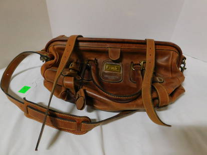 Vintage J. Peterman Leather Duffel Bag: Vintage J. Peterman Leather Duffel Bag,Lexington Kentucky, Gladstone Chestnut quality leather, interior with zipper and brown cloth liner, Italy, brass fittings and lock with key, approx. 19"l, 12"h,