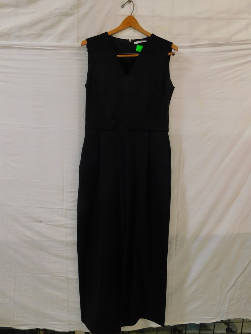 Max Mara Wool Sleeveless Jumpsuit: Max Mara Wool Sleeveless Jumpsuit, size 46 with V neck, Chevron pattern at sides, pleated waist, extra wide legs, back zipper. CONDITION: Very good. No issues identified.